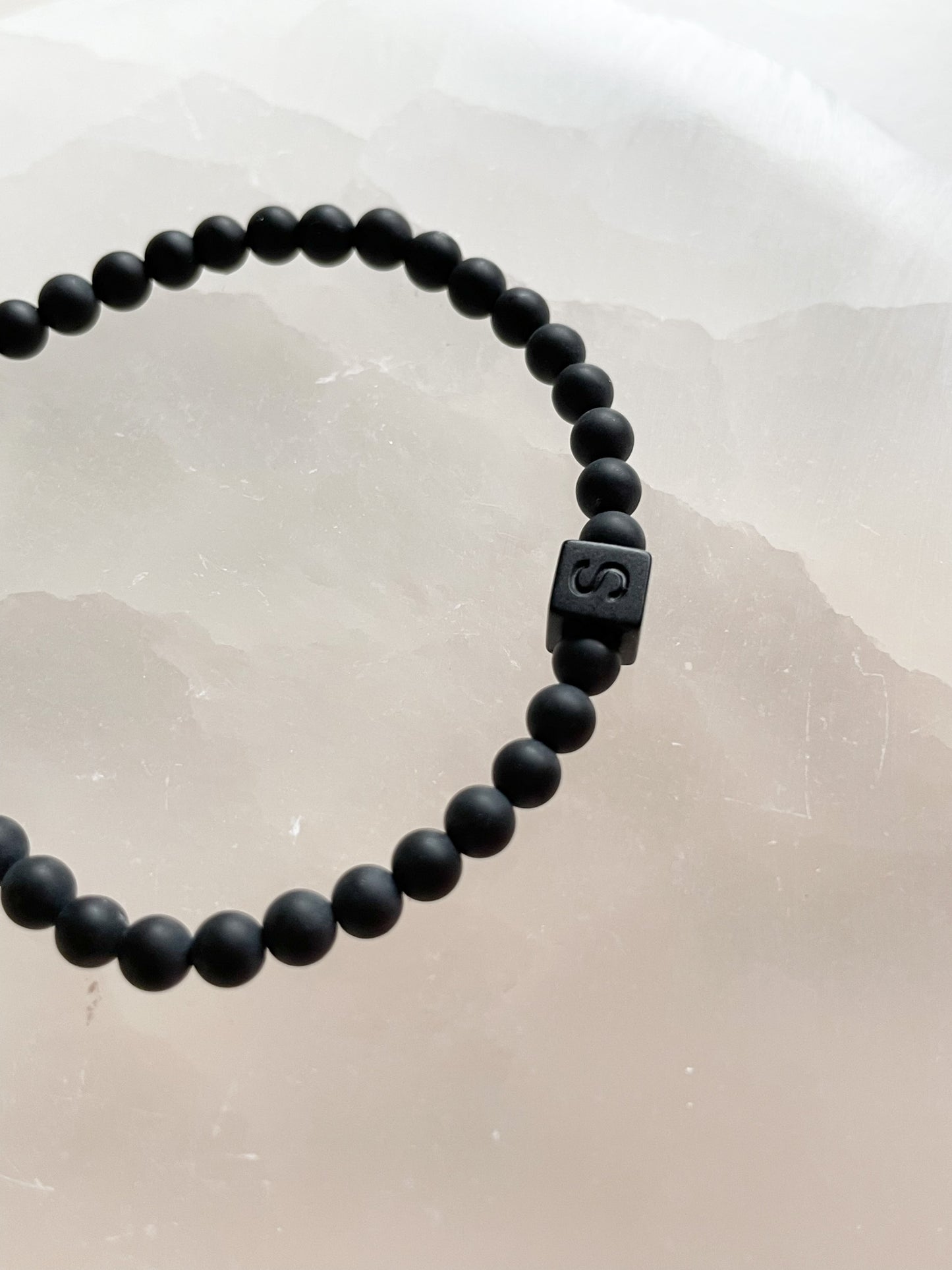 White letters on black beads WITH matte black between
